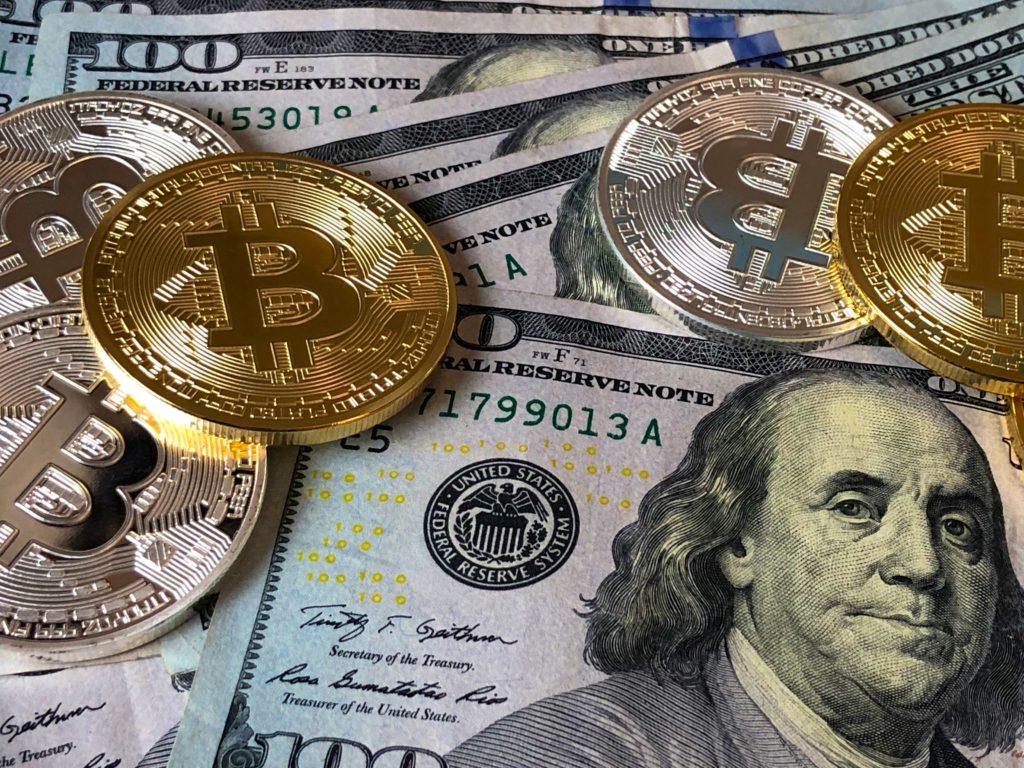 Crypto coins and dollars